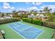 Community basketball court with playground and pool in background at 9085 Bernini Pl, Sarasota, FL 34240