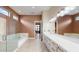 Spa-like bathroom with soaking tub, double vanity and walk-in shower at 9085 Bernini Pl, Sarasota, FL 34240