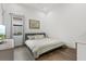 Comfortable bedroom with a king-size bed and wood floors at 9085 Bernini Pl, Sarasota, FL 34240