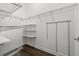 Large walk-in closet with ample shelving and hanging space at 9085 Bernini Pl, Sarasota, FL 34240