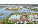 Community pool with lounge chairs and a clubhouse at 9085 Bernini Pl, Sarasota, FL 34240