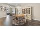 Charming dining room with round table and built-in hutch at 9085 Bernini Pl, Sarasota, FL 34240