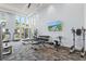 Well-equipped fitness center with various exercise machines and weights at 9085 Bernini Pl, Sarasota, FL 34240