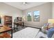 Spacious home office features built-in shelving and large windows at 9085 Bernini Pl, Sarasota, FL 34240