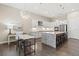 Modern kitchen with white cabinets, granite counters and island at 9085 Bernini Pl, Sarasota, FL 34240