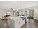 Open kitchen features a large island and stainless steel appliances at 9085 Bernini Pl, Sarasota, FL 34240