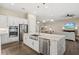 Spacious kitchen boasts modern appliances and a large island at 9085 Bernini Pl, Sarasota, FL 34240