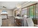 Eat-in kitchen with breakfast bar and access to backyard pool at 9085 Bernini Pl, Sarasota, FL 34240