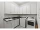 Laundry room with washer, dryer and ample cabinet space at 9085 Bernini Pl, Sarasota, FL 34240