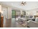 Open living space with hardwood floors and access to pool area at 9085 Bernini Pl, Sarasota, FL 34240