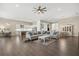 Bright and airy living room with hardwood floors and open concept at 9085 Bernini Pl, Sarasota, FL 34240