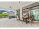 Enjoy alfresco dining on this covered patio with kitchen access at 9085 Bernini Pl, Sarasota, FL 34240