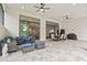 Spacious outdoor patio with seating, dining area and a fire pit at 9085 Bernini Pl, Sarasota, FL 34240