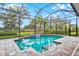 Relaxing screened pool and spa with waterfall feature at 9085 Bernini Pl, Sarasota, FL 34240