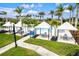 Resort-style pool with shaded seating areas and lounge chairs at 9085 Bernini Pl, Sarasota, FL 34240