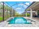 Enclosed pool area with plenty of space for lounging at 9085 Bernini Pl, Sarasota, FL 34240