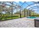 Enjoy the refreshing pool and spacious patio with a screened enclosure at 9085 Bernini Pl, Sarasota, FL 34240