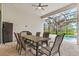 Covered patio with dining area overlooking the refreshing pool at 9085 Bernini Pl, Sarasota, FL 34240