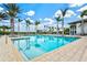 Inviting swimming pool with plenty of lounge chairs at 9085 Bernini Pl, Sarasota, FL 34240
