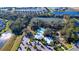 Aerial view of community pool, cabana, and surrounding landscape at 9814 Daybreak Gln, Parrish, FL 34219
