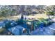 Enclosed dog park with shade, waste disposal, and seating at 9814 Daybreak Gln, Parrish, FL 34219
