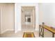 Bright and spacious entryway with tile floors and console table at 9814 Daybreak Gln, Parrish, FL 34219