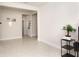 Bright hallway with tile flooring and access to other rooms at 9814 Daybreak Gln, Parrish, FL 34219