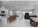 Open concept kitchen with island and living room view at 9814 Daybreak Gln, Parrish, FL 34219