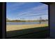 Scenic view of a lake from a screened patio at 9814 Daybreak Gln, Parrish, FL 34219