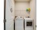 Laundry room with washer, dryer, and overhead shelving at 9814 Daybreak Gln, Parrish, FL 34219