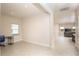Home office with tile floor and view into living area at 9814 Daybreak Gln, Parrish, FL 34219