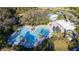 Community pool with lounge chairs and shaded seating at 9814 Daybreak Gln, Parrish, FL 34219