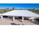 Community pool pavilion with metal roof and patio seating at 9814 Daybreak Gln, Parrish, FL 34219