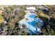 Community pool with lounge chairs and shaded seating at 9814 Daybreak Gln, Parrish, FL 34219
