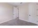 Bright bedroom with neutral walls, carpet, and double door closets at 10128 Milky Way Cir, Sarasota, FL 34241