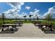 Enjoy this community picnic area with tables, lake views, and a gazebo at 10128 Milky Way Cir, Sarasota, FL 34241