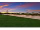 Luxury homes overlook a peaceful lake at sunset at 10128 Milky Way Cir, Sarasota, FL 34241