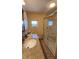 Bathroom with granite countertop, large shower, and window at 10315 Cortez W Rd # 37F, Bradenton, FL 34210