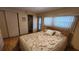 Bedroom with double bed, wood floors, and access to balcony at 10315 Cortez W Rd # 37F, Bradenton, FL 34210
