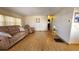 Spacious living room with light wood floors and reclining furniture at 10315 Cortez W Rd # 37F, Bradenton, FL 34210