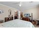 Bedroom with a queen bed and adjacent bathroom at 1106 49Th Avenue W Dr, Bradenton, FL 34207