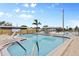 Relaxing community pool with lounge chairs and canal view at 1106 49Th Avenue W Dr, Bradenton, FL 34207