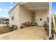 Exterior view of a manufactured home with covered carport and landscaping at 1106 49Th Avenue W Dr, Bradenton, FL 34207