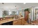 Eat-in kitchen with granite counters, double sink, and ample storage at 1106 49Th Avenue W Dr, Bradenton, FL 34207