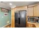 Kitchen boasts stainless steel appliances and light wood cabinets at 1106 49Th Avenue W Dr, Bradenton, FL 34207