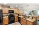 Updated kitchen with granite countertops and stainless steel appliances at 1106 49Th Avenue W Dr, Bradenton, FL 34207
