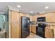 Bright kitchen with granite countertops, stainless steel appliances, and ample cabinet space at 1106 49Th Avenue W Dr, Bradenton, FL 34207