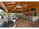 Indoor bar with seating and large screen TVs at 12413 Osorio Ct # 103, Sarasota, FL 34238