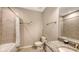 Clean bathroom with tub, shower, and granite countertop at 12413 Osorio Ct # 103, Sarasota, FL 34238