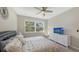 Comfortable bedroom featuring a double bed, large window and dresser at 12413 Osorio Ct # 103, Sarasota, FL 34238